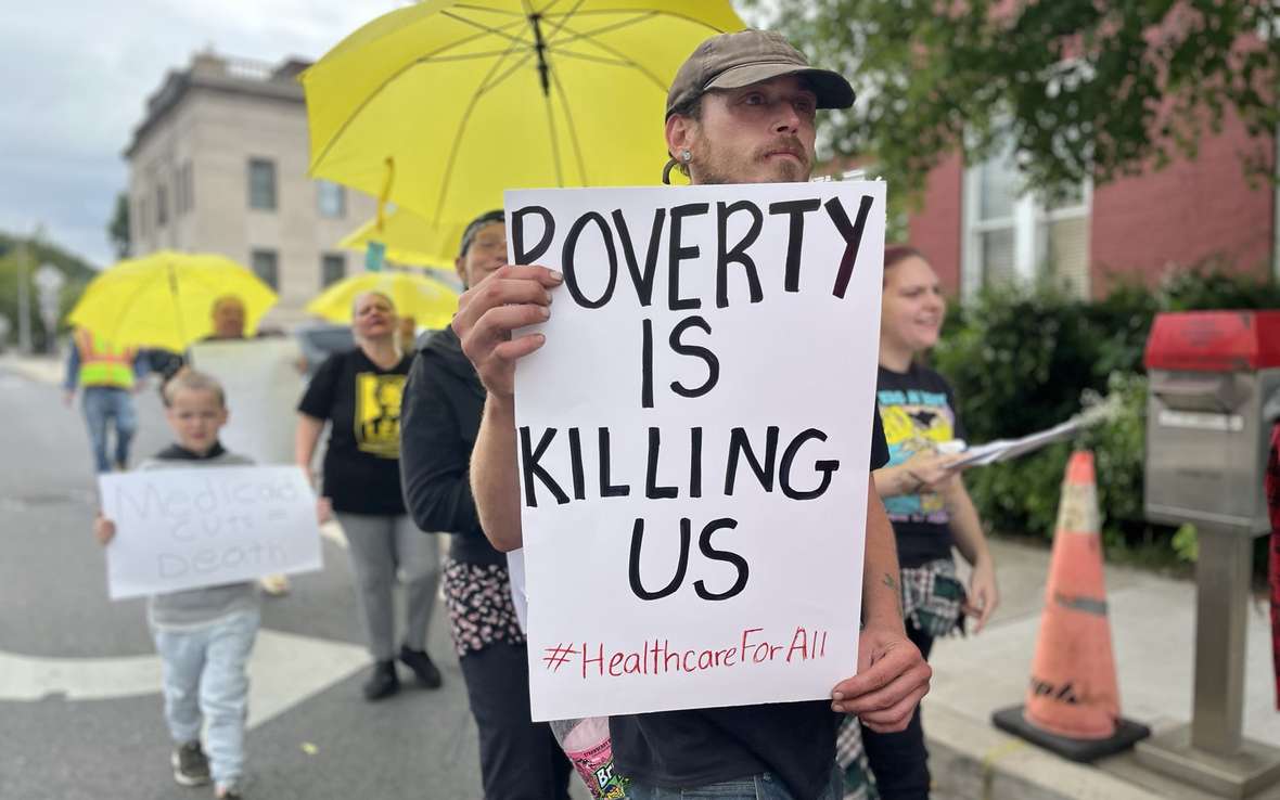  United Workers members march during the Non-Violent Army Medicaid Day of Action 