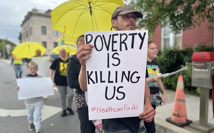 United Workers members march during the Non-Violent Army Medicaid Day of Action