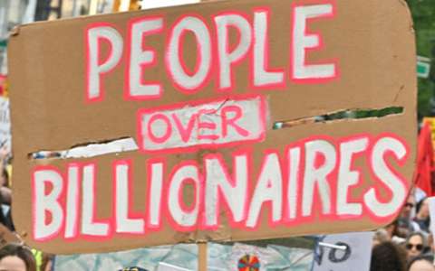 Sign that says people over billionaires