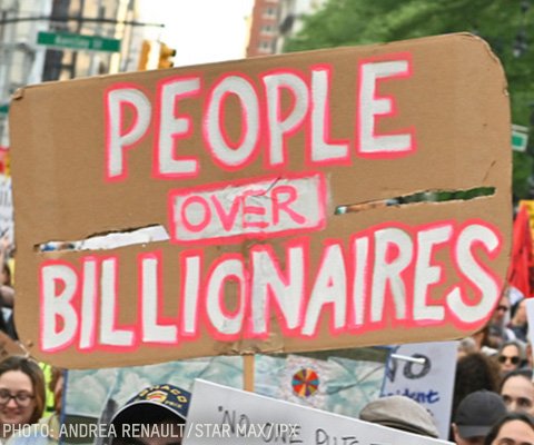  Sign that says people over billionaires 