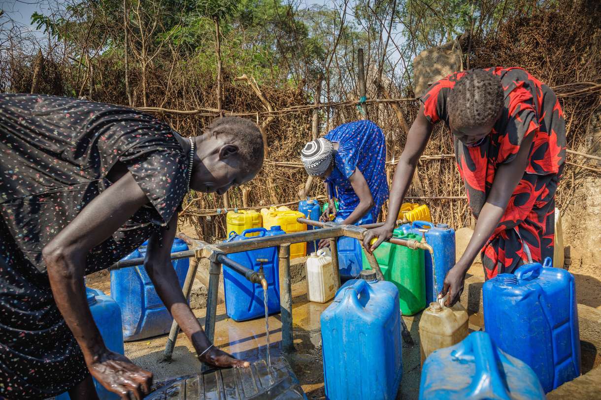 Women fill jerry cans at a tap stand in one of the Gambella refugee camps in western Ethiopia hosting South Sudanese people who have fled conflict.