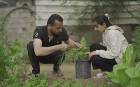 Sami and his daughter tend to their vegetable garden next to their home in Gaza. Oxfam and the Palestinian Agricultural development Association are helping families and commercial farmers in Gaza to start producing vegetables and other food.