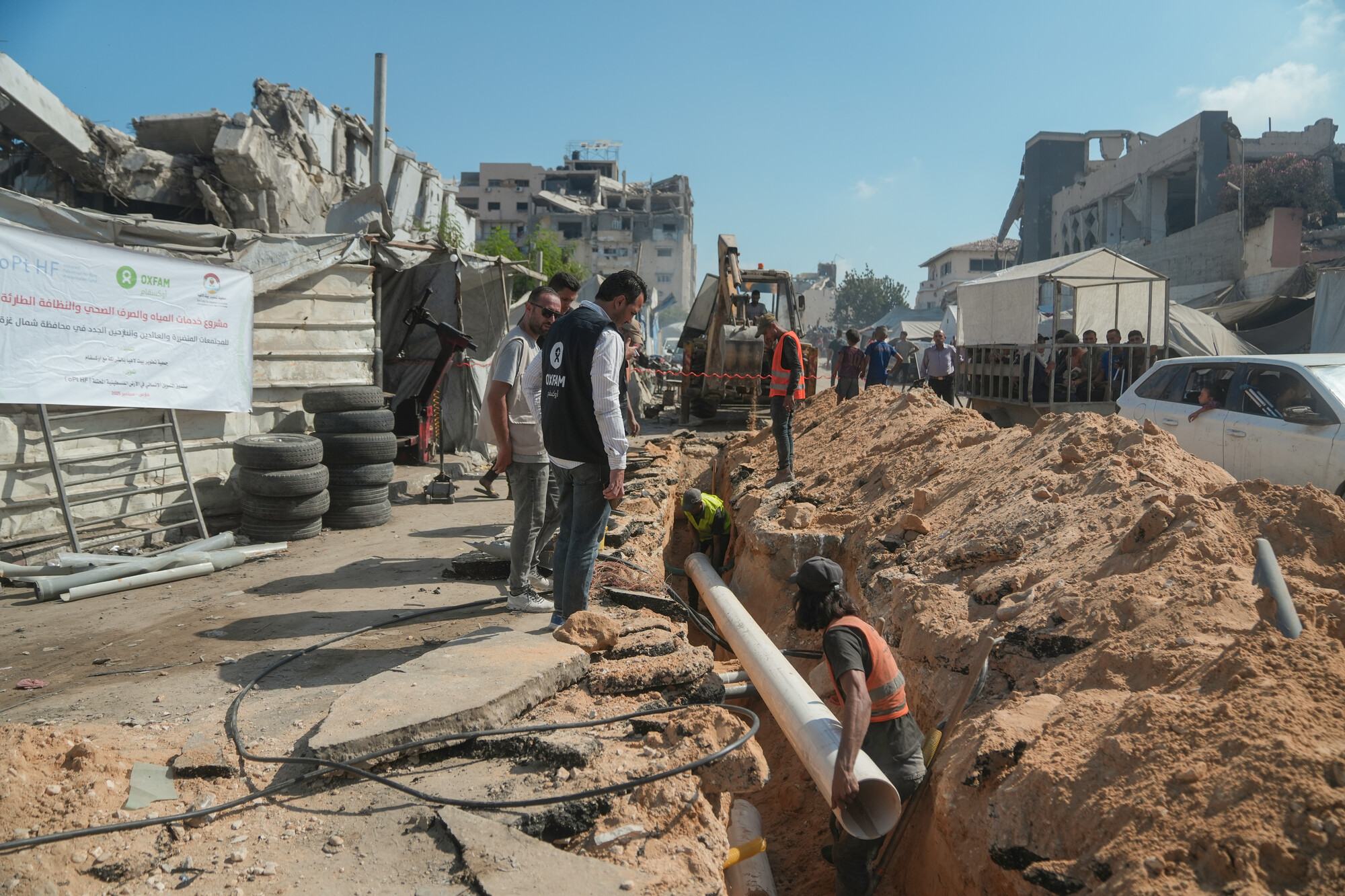  Oxfam staff inspect repairs to municipal water supply pipeline in Gaza. Repairs to this pipeline will improve water access to an area with 40,000 people. 