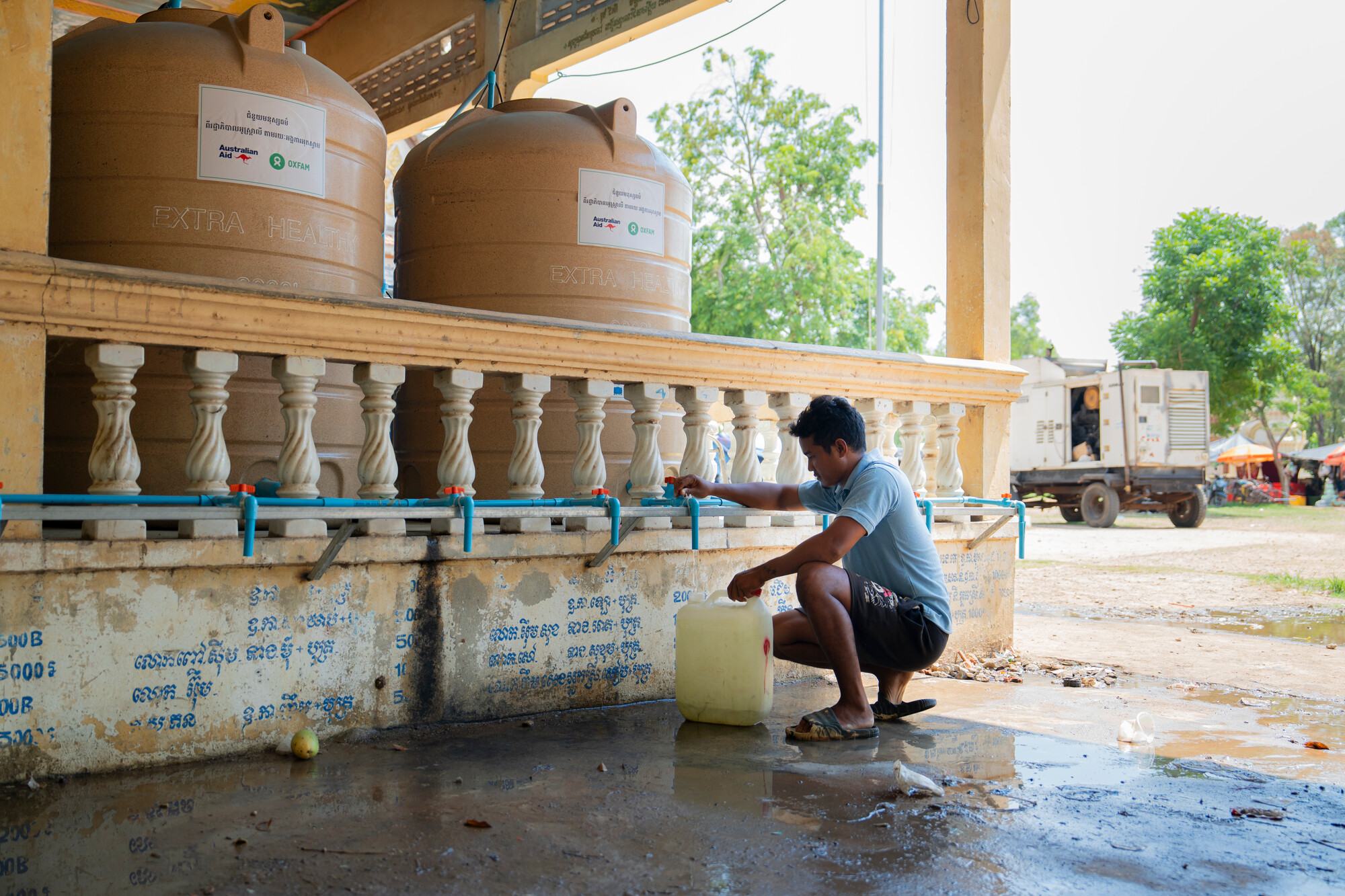  Ra Vin collecting water from the water filtration system at Wat Chan Si safety center and, a daily journey families made. 