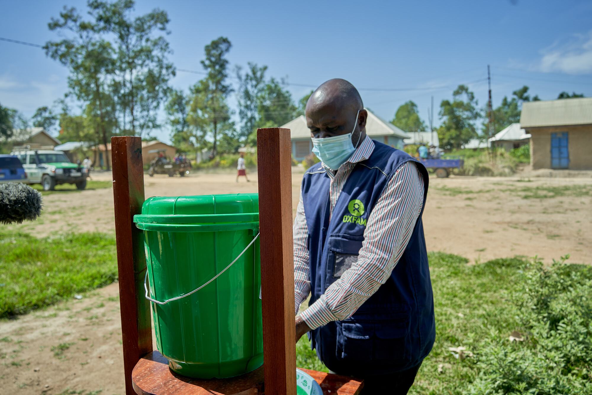  Roger Kilimira, who works for Oxfam in the Democratic Republic of Congo, checks a handwashing stand in a community in Ituri province. 