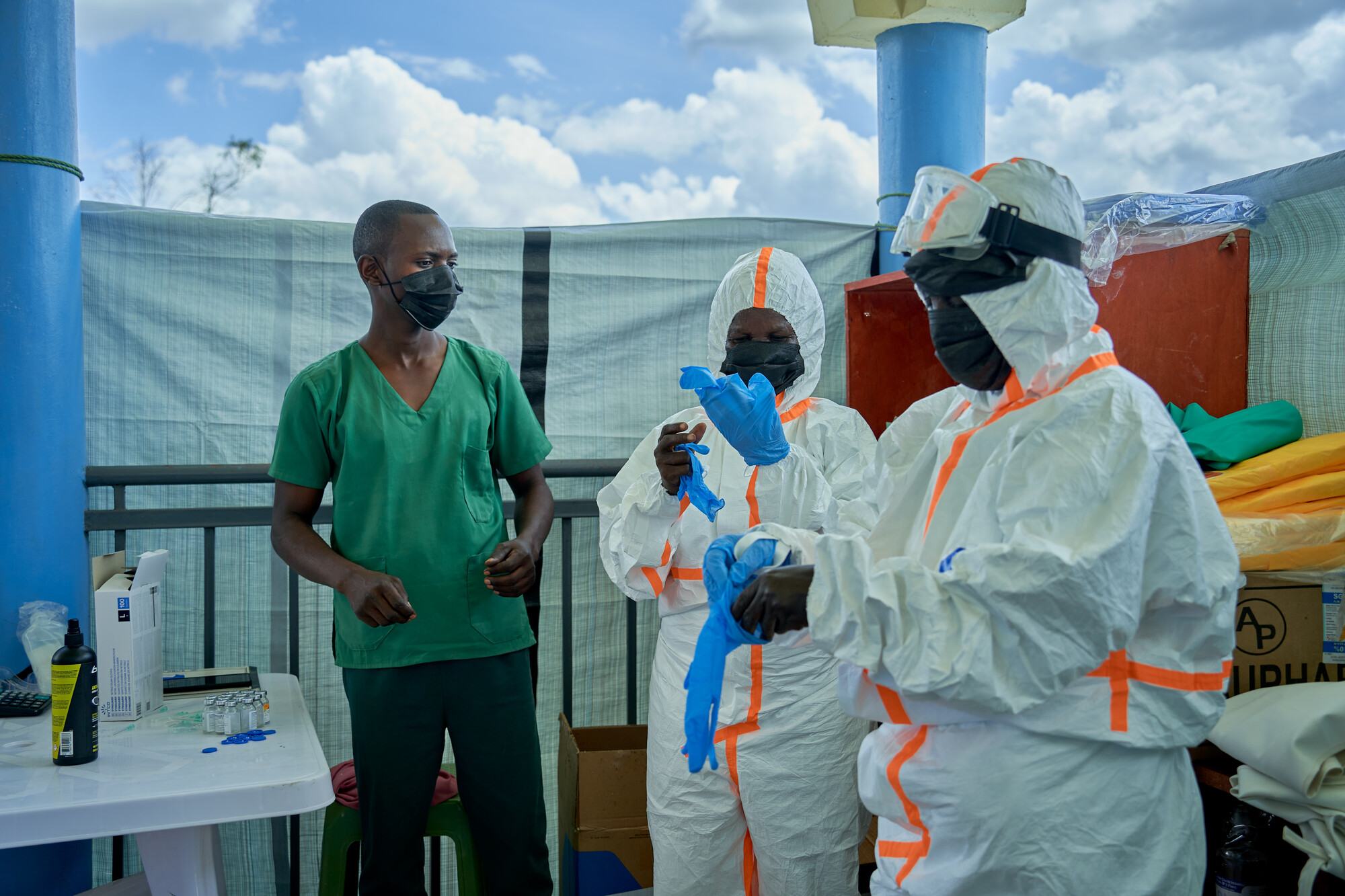  Health workers put on personal protective equipment before going to work in a clinic in Ituri, in an eastern province in the Democratic Republic of Congo. 