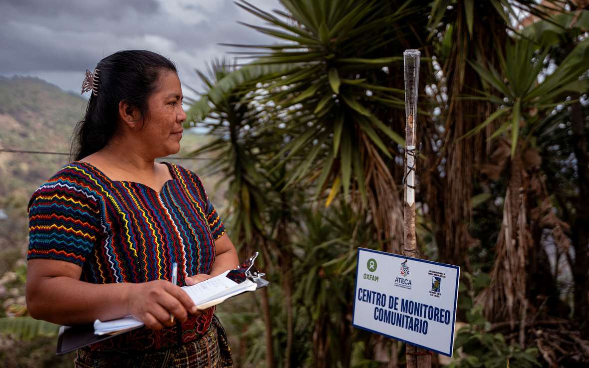  Doña Brenda Alicia Guanché Manuel, 35 years old, monitors the rain gauge outside her home in Chixim, Baja Verapaz, Guatemala. The daily weather observations she collects help small local farmers make informed decisions about planting in the Dry Corridor. 