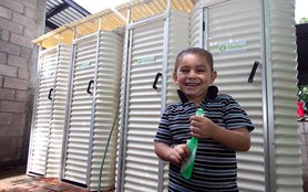 el-salvador-boy-with-latrines-oct2011.jpg