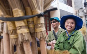 vietnam-woman-vendor-brooms-ous-52935-h.jpg